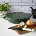Thermomix® cast iron casserole dish with ingredients staged nearby