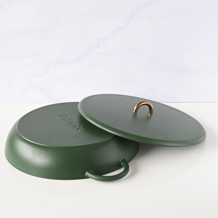 Bottom of empty cast iron casserole dish showing base