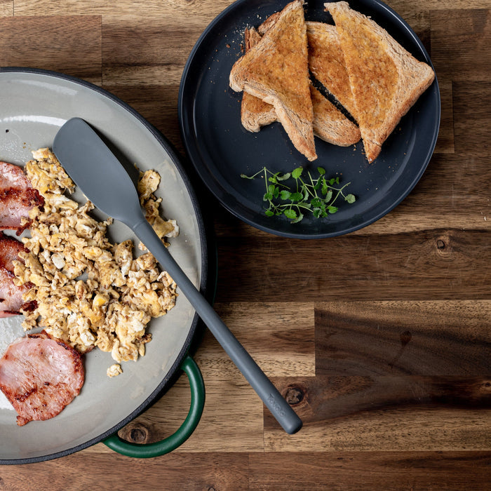 Tovolo Utensils Flex-Core Silicone Spatula in Firra Cast Iron pan