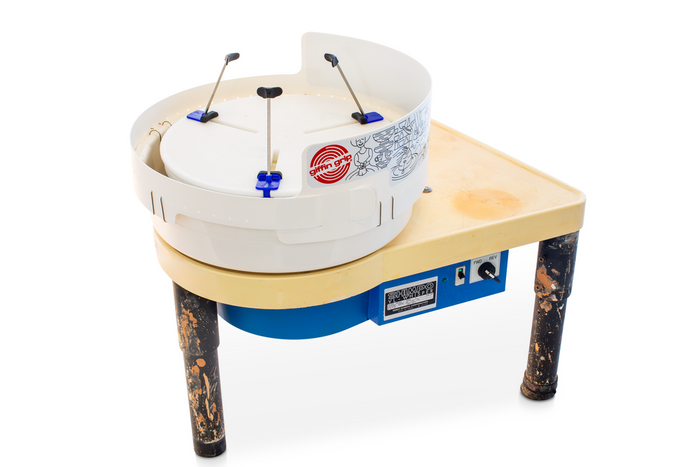 Giffin Grip Model 10 installed on a pottery wheel head, three arms raised, inside a white splash pan with Giffin Grip logo