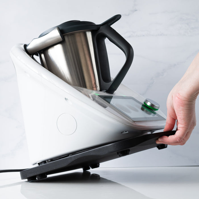 Black slider board with Thermomix TM6 being moved