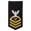 Navy E7 FEMALE Rating Badge: IS Intelligence Specialist - seaworthy gold on blue